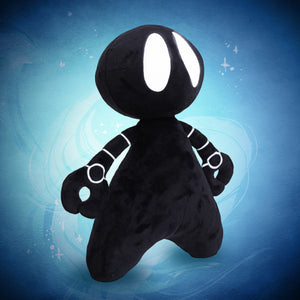A plush toy resembling a stylized character with white embroidered eyes and details, predominantly in black color, against a blue background.